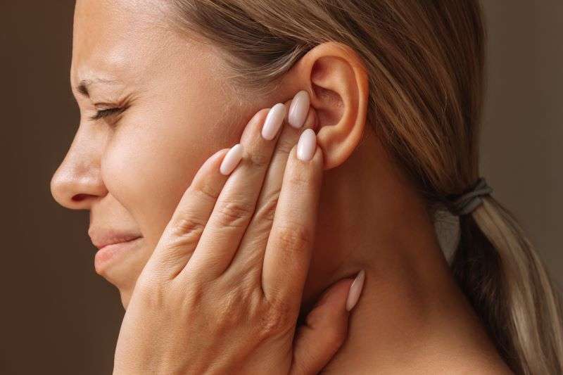 woman with ear ache